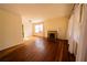 Inviting living room featuring beautiful hardwood floors and a brick fireplace at 1751 Tiger Flowers Nw Dr, Atlanta, GA 30314