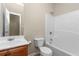 Standard bathroom featuring a wood vanity, single sink, toilet, and shower-tub combination at 201 Creel Way, Atlanta, GA 30349