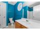 Bright bathroom features a modern vanity, large mirror, and a shower/tub combination at 201 Creel Way, Atlanta, GA 30349