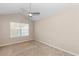 Bedroom with neutral carpet, ceiling fan, and window, offering a cozy and bright space at 201 Creel Way, Atlanta, GA 30349