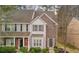 Charming townhome featuring stone and siding exterior with well-maintained landscaping and a welcoming entrance at 201 Creel Way, Atlanta, GA 30349