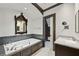 Well-lit bathroom with a deep soaking tub and unique fixtures at 2628 Rivers Nw Rd, Atlanta, GA 30305