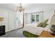 Bedroom with a chandelier, neutral decor, and a charming window seat at 2628 Rivers Nw Rd, Atlanta, GA 30305