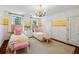 Bright bedroom featuring two twin beds and stylish accents at 2628 Rivers Nw Rd, Atlanta, GA 30305