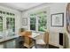 Cozy dining area with hardwood floors and a view to the outdoor scenery at 2628 Rivers Nw Rd, Atlanta, GA 30305