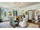 Dining room with large table, chandelier, and lots of natural light at 2628 Rivers Nw Rd, Atlanta, GA 30305
