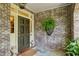 Inviting front porch with brick walls and stylish accents at 2628 Rivers Nw Rd, Atlanta, GA 30305