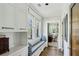 Bright hallway with built-in storage, seating, and hardwood floors at 2628 Rivers Nw Rd, Atlanta, GA 30305