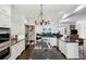 Contemporary kitchen with stainless appliances, center island, and access to upper level at 2628 Rivers Nw Rd, Atlanta, GA 30305