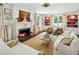 Elegant living room featuring a fireplace, bookshelves, and comfortable seating at 2628 Rivers Nw Rd, Atlanta, GA 30305
