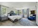Spacious main bedroom with abundant natural light, blue accents, and elegant decor at 2628 Rivers Nw Rd, Atlanta, GA 30305