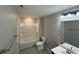 Bathroom featuring tile floors, a shower-tub combo and single sink vanity with a large mirror at 2460 Laurel Gate Ln, Cumming, GA 30040