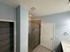 Modern bathroom with tiled shower, glass enclosure, and bright lighting at 2460 Laurel Gate Ln, Cumming, GA 30040