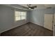 Cozy bedroom with a ceiling fan and natural light from the window at 2460 Laurel Gate Ln, Cumming, GA 30040