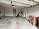 Spacious garage features ample storage space, water heater, and easy access to the house at 2460 Laurel Gate Ln, Cumming, GA 30040