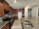 Gourmet kitchen island with stainless steel sink, granite countertops, and matching cabinets at 2460 Laurel Gate Ln, Cumming, GA 30040