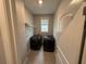 A view of the home's laundry room featuring modern washer and dryer units in a cozy space at 2460 Laurel Gate Ln, Cumming, GA 30040