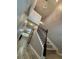 Carpeted staircase with iron railings leading to the upper level at 2460 Laurel Gate Ln, Cumming, GA 30040