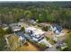 Stunning aerial view of a modern home nestled in a lush neighborhood with mature trees at 4232 Edgewood Ct, Marietta, GA 30068