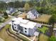 Aerial view of a modern home with professionally landscaped yard, complete with a backyard pool and patio at 4232 Edgewood Ct, Marietta, GA 30068