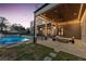 Stunning backyard featuring a modern pool, covered patio, and sleek outdoor furniture, perfect for entertaining at 4232 Edgewood Ct, Marietta, GA 30068