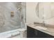 Bright bathroom featuring a walk-in shower, custom fixtures, modern lighting and a sink at 4232 Edgewood Ct, Marietta, GA 30068