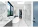 This bathroom boasts a soaking tub, glass enclosed shower, double vanity, and stylish fixtures at 4232 Edgewood Ct, Marietta, GA 30068