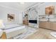 Bright bedroom suite with modern fireplace, decorative art and floating shelves at 4232 Edgewood Ct, Marietta, GA 30068