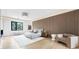 Cozy bedroom with wood accent wall, a large window and modern decor at 4232 Edgewood Ct, Marietta, GA 30068