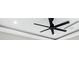 A modern ceiling fan with a black finish, installed in a light and airy room at 4232 Edgewood Ct, Marietta, GA 30068