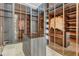 Spacious walk-in closet with custom shelving, drawers, and glass doors at 4232 Edgewood Ct, Marietta, GA 30068