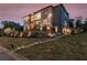 Contemporary home with large windows, stone retaining wall, a garden, and stairs leading to the front door at 4232 Edgewood Ct, Marietta, GA 30068