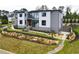 Eye-catching modern home with a stone retaining wall, lush green lawn, and an inviting front entrance at 4232 Edgewood Ct, Marietta, GA 30068