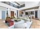 Open-concept home with high ceilings, hardwood floors, and modern furnishings in the living and kitchen areas at 4232 Edgewood Ct, Marietta, GA 30068