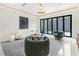Bright living room with unique decor, recessed lighting and large sliding glass doors to the patio at 4232 Edgewood Ct, Marietta, GA 30068