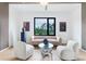 Bright and modern living room with hardwood floors, large window and neutral colored furniture at 4232 Edgewood Ct, Marietta, GA 30068