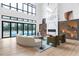 Sunlit living room with modern furniture, hardwood floors, and sliding glass doors to the patio and pool at 4232 Edgewood Ct, Marietta, GA 30068