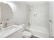 Bright bathroom with white cabinets, marble tile walls, and modern fixtures at 520 Willeo Rd, Roswell, GA 30075