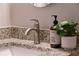 Close up of granite countertop, faucet, and soap in bathroom at 520 Willeo Rd, Roswell, GA 30075