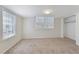 Neutral bedroom with carpet flooring, two windows, and a closet at 520 Willeo Rd, Roswell, GA 30075