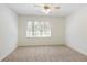 Spacious bedroom with natural light and neutral carpet flooring at 520 Willeo Rd, Roswell, GA 30075
