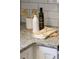 The stylish kitchen has neutral colored countertop with decor and wood cooking utensils at 520 Willeo Rd, Roswell, GA 30075