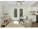 Bright living room with seating area and a view to the kitchen and back deck at 520 Willeo Rd, Roswell, GA 30075