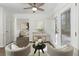 Bright living room with neutral decor, two chairs, a coffee table and entry to back deck at 520 Willeo Rd, Roswell, GA 30075