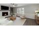 Comfortable living room boasts a fireplace, built-in shelves, ceiling fan, and neutral decor at 520 Willeo Rd, Roswell, GA 30075