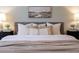 Detailed shot of the bed in the main bedroom with decorative pillows at 520 Willeo Rd, Roswell, GA 30075