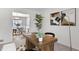 Well-lit office space featuring modern decor, view of dining room, hardwood table, and light-colored carpet at 520 Willeo Rd, Roswell, GA 30075