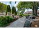Serene outdoor space with tables, benches, and historical markers surrounded by greenery at 520 Willeo Rd, Roswell, GA 30075
