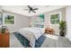 Bright bedroom with two windows, ceiling fan, and modern decor at 665 S Eugenia Nw Pl, Atlanta, GA 30318