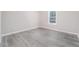 Bedroom with laminate wood flooring and a large window at 665 S Eugenia Nw Pl, Atlanta, GA 30318